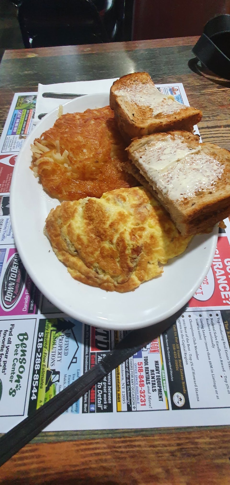 Diner menu featuring omelets and sandwiches.